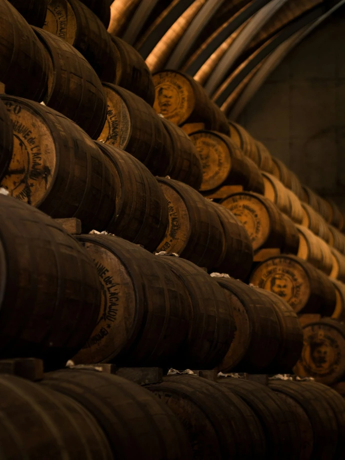 low light photography of pile of barrels